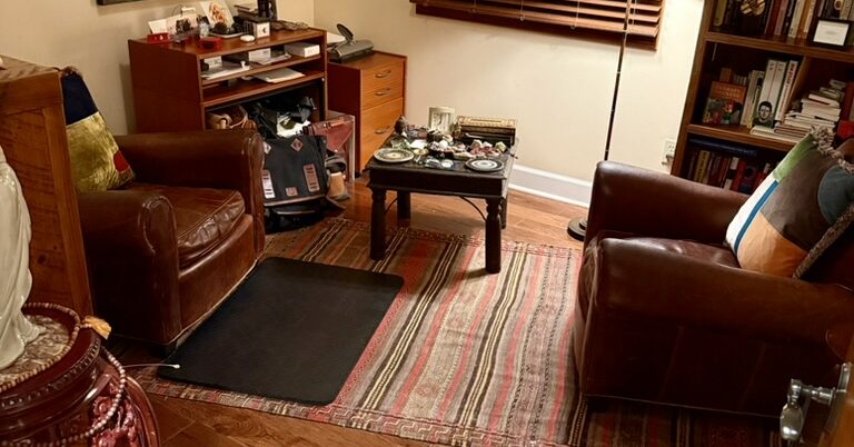 Two leather armchairs facing each other in the Higher Mind Counseling office